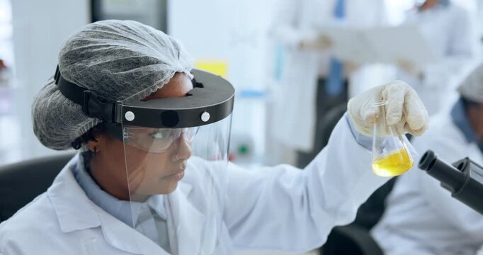 Science, chemical and woman in lab with liquid for study, medical research and discovery. Biotechnology, safety gear and person with glass beaker for vaccine development, medicine and analysis