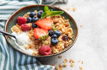 Granola bowl with fresh berries for healthy breakfast