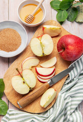 Baking ingredients for apple dessert on wooden table