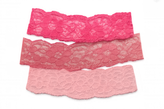 Pink lace fabric pieces with torn edges, displaying different shades of pink, set on a transparent background