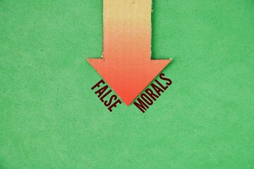Down arrow with the words false morals. discrepancy between proclaimed values and actual behavior hypocrisy or a flawed ethical argument that falsely equates two different things.