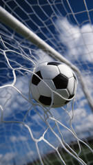Fototapeta premium Soccer ball flying into the goal net