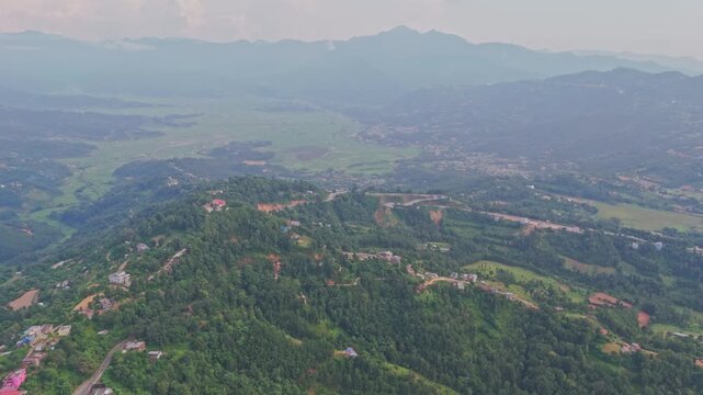Beautiful hillside view of Tansen Palpa, Nepal, showcasing green mountains, traditional houses, and the peaceful charm of this historic hill town surrounded by nature.