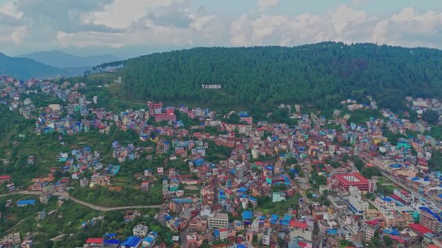 Beautiful hillside view of Tansen Palpa, Nepal, showcasing green mountains, traditional houses, and the peaceful charm of this historic hill town surrounded by nature.