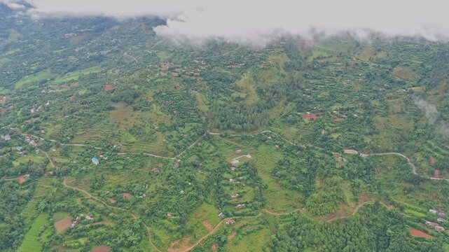 Aerial footage of hillside roads in Tansen Palpa, Nepal, showing winding mountain routes, lush green hills, and the stunning beauty of the rural landscape. Perfect for travel and nature themes.