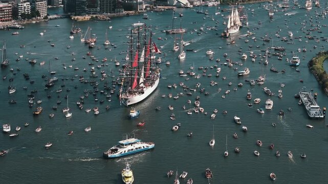 A crowd of small boats swarms the Peruvian flagship in a circle of awe