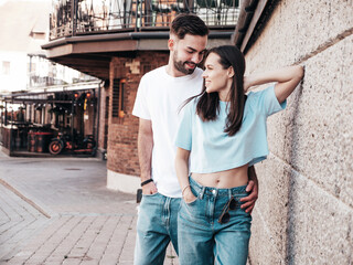 Smiling beautiful woman and her handsome boyfriend. Woman in casual summer jeans clothes. Happy...
