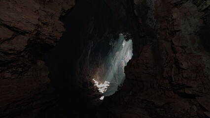 Drifting through a majestic cave, beams of sunlight illuminate the rocky landscape and create a mystical atmosphere. Natures beauty captivates explorers lost in adventure.