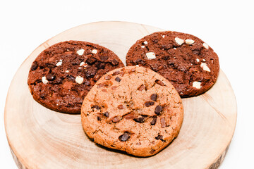 stuck of chocolate brownie cookies on wooden background. Homemade pastry.