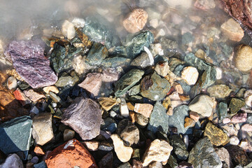 Multi coloured stone chips in Himalayan river