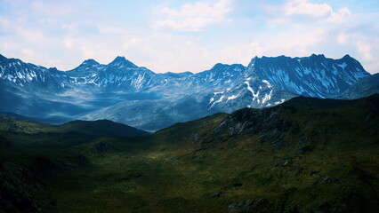 Obraz premium A breathtaking view of rugged mountains surrounded by lush green valleys under a bright blue sky with fluffy clouds. The sunlight highlights the snow capped peaks, creating a stunning contrast.