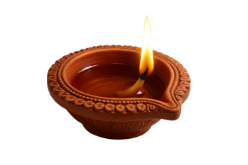 Rustic terracotta oil lamp with a sculpted border and lit wick, casting a warm light for the auspicious occasion of happy diwali, isolated on transparent background