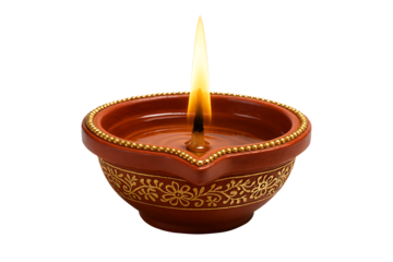Terracotta decorative oil lamp with gold accents and burning flame, an essential item for the happy diwali celebration, isolated on transparent background