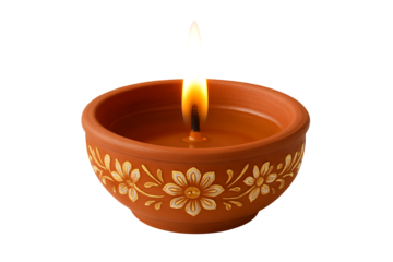 Clay diya oil lamp with beautiful golden flower decoration and bright flame for happy diwali festival celebration isolated on transparent background