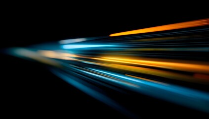 Dynamic abstract streaks of vibrant blue and fiery orange light blur across a dark background creating a sense of speed and motion