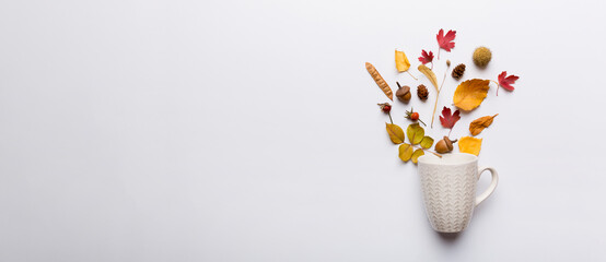 Autumn composition with cup and dried leaves on table. Flat lay, top view, copy space