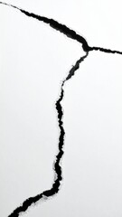 Cracks radiating from a central point on white surface