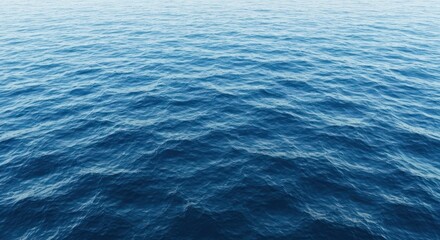 Obraz premium Calm, rippling blue ocean surface, transitioning from light to darker tones