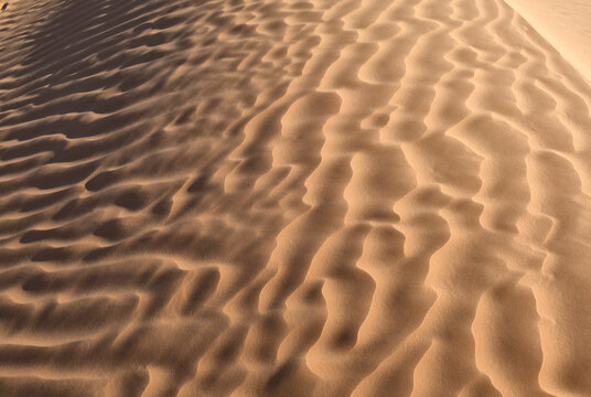 Close up of desert sand textures with light and shadow in Sahara Tunisia