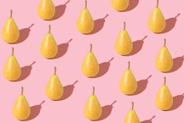 Trendy sunlight Summer pattern made with pear on bright light pink backround.Minimal summer concept