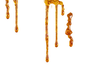 Isolated drops of golden honey dripping, falling sticky liquid amber syrup sweetener