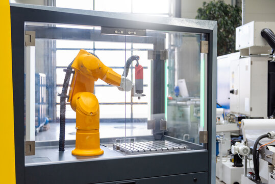 Industrial robot arm in production facility performing automated task