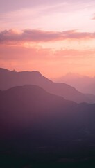 Fototapeta premium Majestic mountain sunset a breathtaking panorama of vibrant pink orange hues and serene peaceful atmosphere