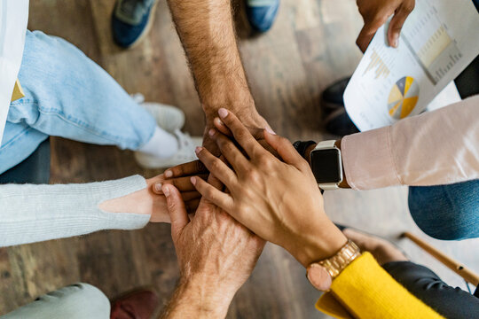 Close-up of business team stacking hands
