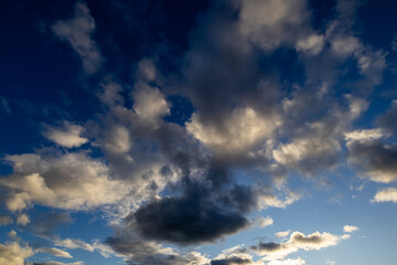 Dramatic evening clouds against blue sky