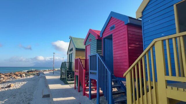 Colourful beach huts of St James beach in Cape Town, South Africa.