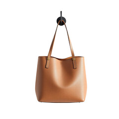 Stylish tan leather tote bag hanging, perfect for everyday essentials or a chic shopping trip, versatile and elegant design for the modern woman on the go