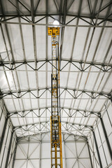 Repairs are carried out using a tower lift, on the roof of the workshop inside the premises,...