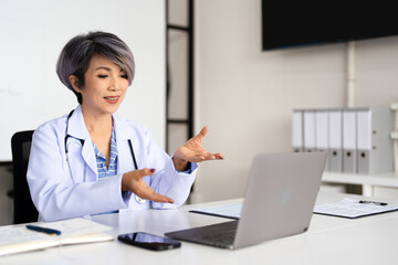 Online Video Chat by Doctor. Online medical consultation. Doctor working via video chat application.
