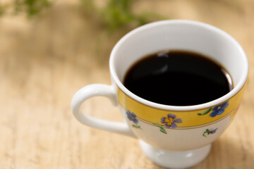 ティーカップに入れたホットコーヒー Hot coffee in a teacup