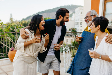 Latin family enjoying a cheerful Brazilian barbecue together outdoors