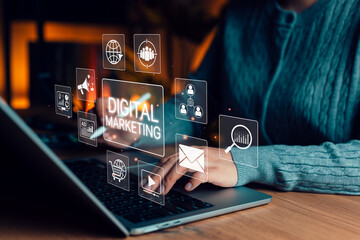 Digital marketing strategy concept. Person using laptop with marketing icons, SEO, email, social...
