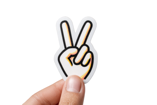 Hand holding a peace sign sticker