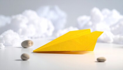 Yellow paper plane on white, cotton clouds background