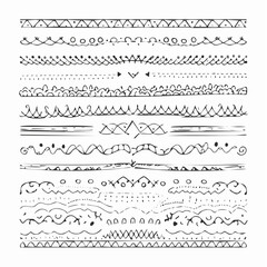Fototapeta premium Set of hand drawn line borders, scribble strokes and design elements isolated on white. Doodle style brushes. Monochrome vector eps8 illustration.