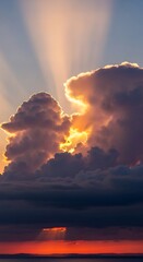 Golden Hour Radiance - Sunbeams Through Dramatic Clouds at Sunset.