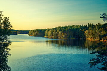 Tranquil Lake in a Forest at Golden Hour