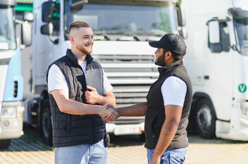 Truck drivers shaking hands doing business agreement