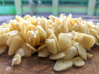 Sliced Garlic Cloves And Chips Close-Up For Cooking