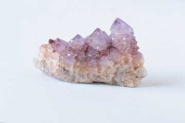 A purple crystal with a white base