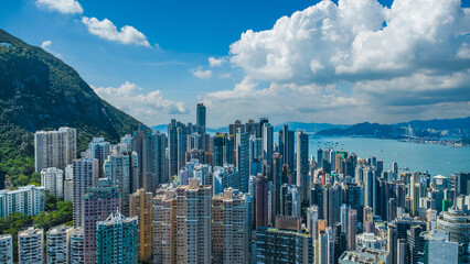 Latest October 2025 aerial view of Hong Kong business skyscrapers, Victoria Harbour, Sheung Wan,...