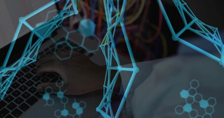 Typing man wearing lab coat on laptop at server room desk, displaying molecular modeling overlays