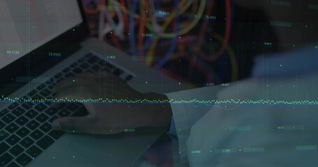 Typing engineer's right hand on silver laptop keyboard in server room, with data overlay and cables