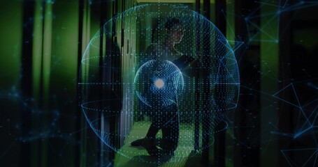 Crouching technician interacting with blue holographic sphere in server room with tablet and racks