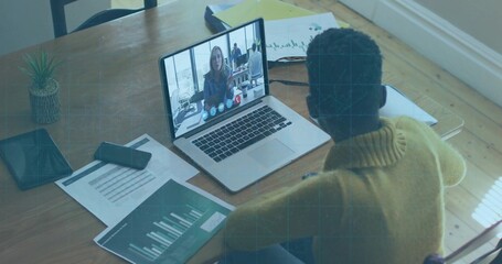 Sitting sweater wearing professional reviewing charts joining call at home, with laptop smartphone