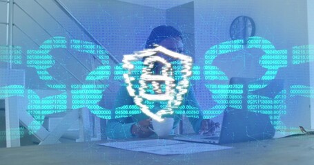Manipulating IT specialist wearing tie interacting with digital interface at desk, with laptop
